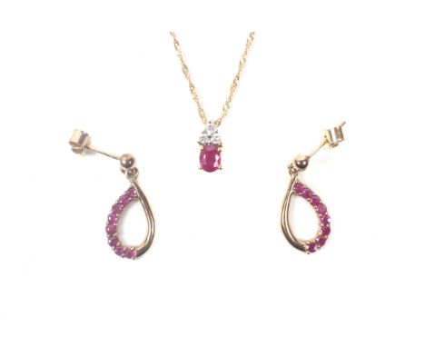 A pair of ruby and diamond open drop earrings stamped '9ct' and a necklace stamped '585'. Condition Report: Necklace length a