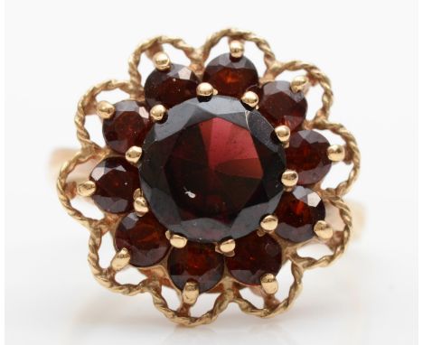 A 9ct gold garnet cluster ring, size O, 4.2gm. 