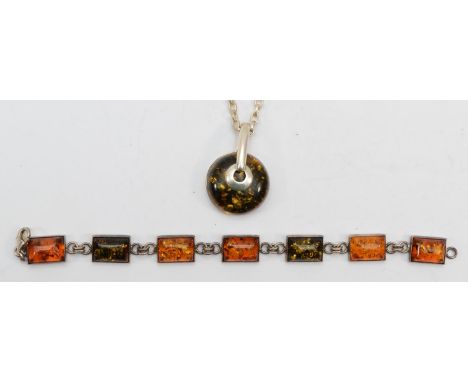 A silver Baltic amber pendant on chain, 56cm, together with a silver amber bracelet, 34gm. 