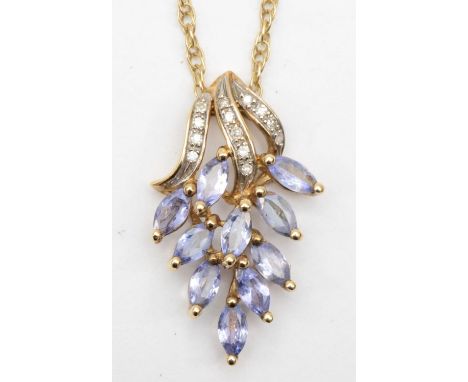 A 9ct gold tanzanite and diamond floral pendant, 23mm, on chain, 38cm, 3.2gm. 