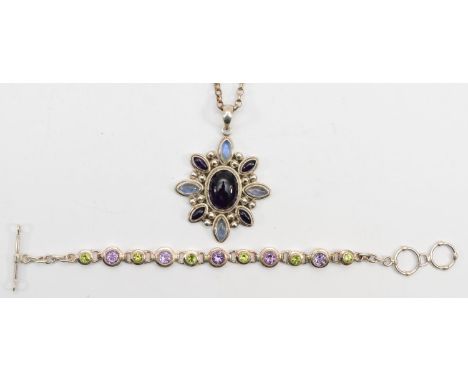 A silver moonstone and amethyst pendant on chain, 6cm, together with an amethyst and peridot bracelet, 48gm. 