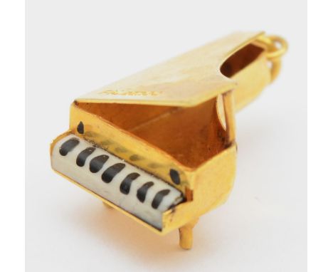 A 9ct gold grand piano charm, 2cm, 1.4gm. 