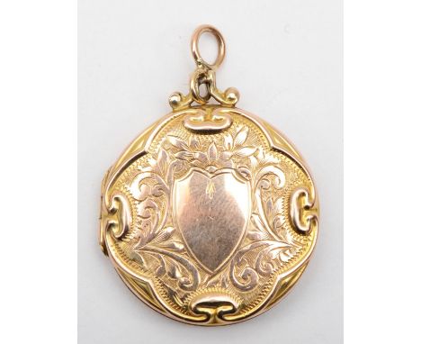 A Victorian 9ct front and back gold locket with scrolling decoration, 3cm. Condition report - The locket will not close secur