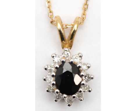 A unmarked gold sapphire and diamond cluster pendant, 15mm, chain 46cm, 1.7gm. 