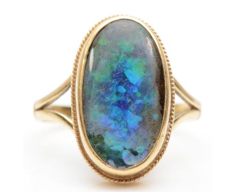 A 9ct gold opal doublet set ring, size M-N, 3.8gm. 