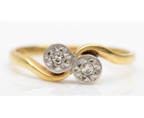 An Art Deco 18ct gold illusion set diamond two stone ring, size M -N, 2.2gm. 