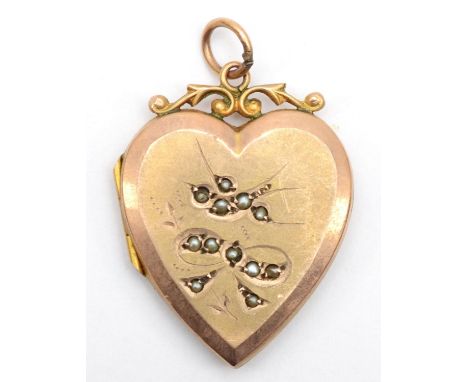 A Victorian 9ct gold front and backed heart shaped locket with seed pearls, 3 x 2 cm. Condition report - opens and closes fin