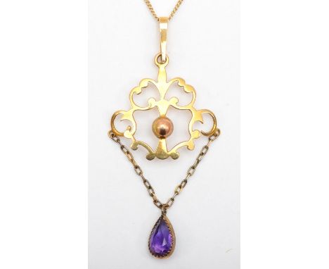 An Edwardian 9ct gold openwork pendant with amethyst drop on chain, 45cm, 2.6gm. 
