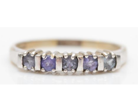 A 9ct white gold and five stone tanzanite ring, R, 2.7gm 