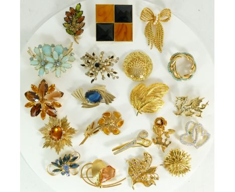 A group of vintage gold plated brooches to include glass set examples, 383gm. 
