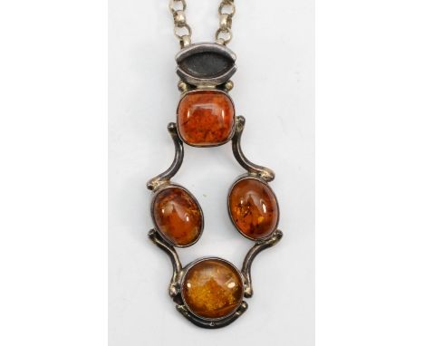 A silver Modernist Baltic amber pendant on belcher chain, 51cm, 39gm. 