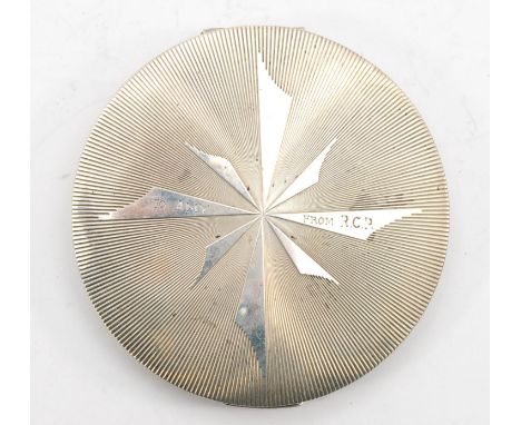 A George V silver compact and mirror, Birmingham 1922, with engine turned decoration,  7cm. 