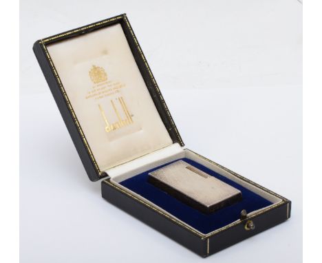 Dunhill 70, a silver plated gas lighter with engine turned decoration, serial number BQ022, case. 
