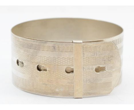 An Art Deco sterling silver cuff bracelet with engine turned decoration, adjustable size 6.5 - 5.2cm, 30gm. 