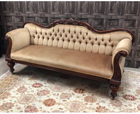 VICTORIAN MAHOGANY SCROLL END SOFA, with gold coloured upholstery, with turned, tapered legs, on castors, 205cm wide, 92cm hi