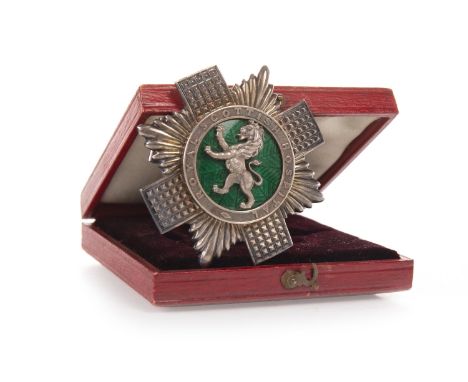 SILVER AND ENAMEL ROYAL SCOTTISH HOSPITAL BADGE, the obverse with central lion rampant motif in relief on green enamel, withi