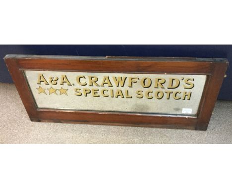 WHISKY RELATED MIRRORED PANEL, inscribed 'A &amp; A Crawford's Special Scotch', in a walnut frame, 36cm x 85cm