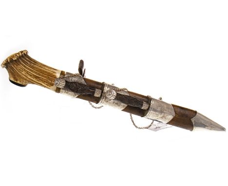 WHITE METAL MOUNTED SCOTTISH DIRK, with antler handle, along with knife and fork, each with carved wooden handles, all contai