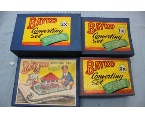 Four boxed Bayko converting sets 