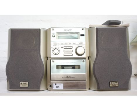 'SHARP' MINI MUSIC SYSTEMmodel number XL60H, with a compact disc player, RDS tuner, cassette player, two speakers, hand held 