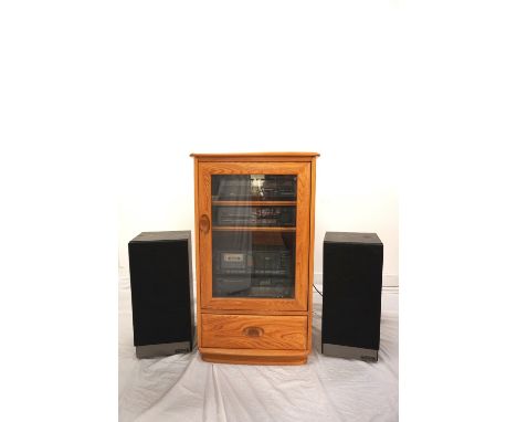 'ERCOL' BLONDE ELM MUSIC CABINETthe lift up top above a glass panel door revealing a Trio music system comprising a turntable