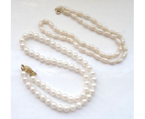 TWO WHITE CULTURED PEARL NECKLACESone with nine carat gold reeded oval clasp and approximately 42.5cm long; the other with a 