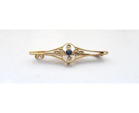 EDWARDIAN SAPPHIRE AND SEED PEARL FIFTEEN CARAT GOLD BROOCHthe central round cut sapphire approximately 0.25cts in foliate su