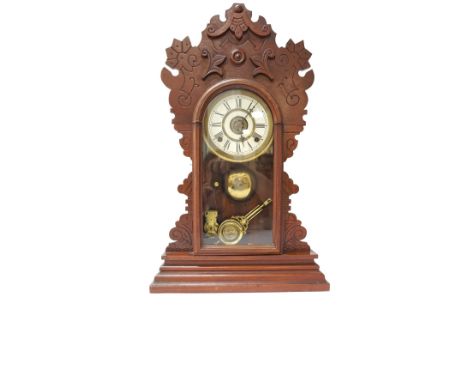 AMERICAN WALNUT CASED EIGHT DAY SPRING STRIKE 'BENTON' MANTEL CLOCKearly 20th century, by the 'Waterbury Clock Company', with