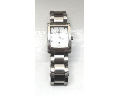 GENTLEMAN'S BULOVA STAINLESS STEEL WRISTWATCHthe rectangular dial with button five minute markers and date aperture, the back