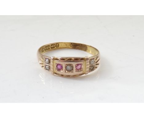 LATE VICTORIAN RUBY AND SEED PEARL RINGon fifteen carat gold shank, ring size P