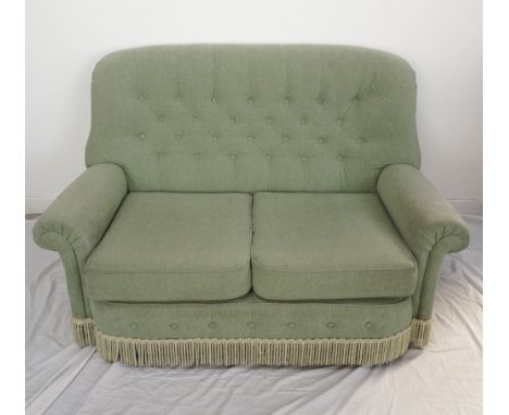 MODERN BUTTON BACK THREE PIECE SUITEcomprising a two seat sofa, an armchair and a reclining armchair, covered in a mint green