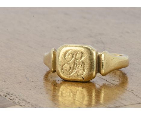 An 18ct gold signet ring, with cushion shaped tablet, on tapered hallmarked shank, Birmingham 1924, ring size N, 5.6g 