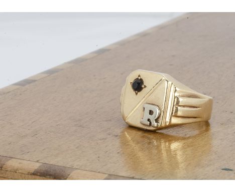 A continental gentleman's signet ring, set with black gemstone, and the letter R, marked 14 to shank, ring size Q, 7.8g 