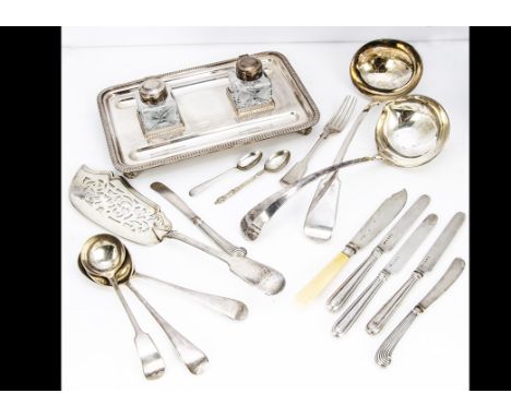 A small group of silver and silver plate, including a pair of dessert knives with silver blades and filled handles, a silver 