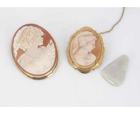 A shell carved cameo brooch, depicting a three quarter length portrait of a young classical maiden in 14ct gold mount, 5.1 cm