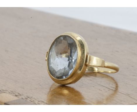 A continental aquamarine dress ring, the mixed oval cut aquamarine in stepped gold mount, ring size R, marked 14k to inner sh