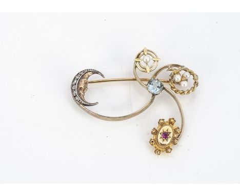 An Edwardian 15ct gold spray brooch, possibly representing night and day with diamond set crescent moon, gypsy set ruby centr