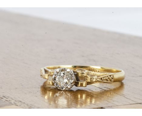 A continental yellow metal and diamond solitaire, the brilliant cut in illusion setting with stepped shoulders, ring size Q, 