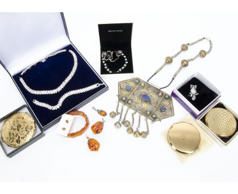 A large collection of costume jewellery,  including a Middle Eastern and lapis lazuli large panel pendant, various compacts, 
