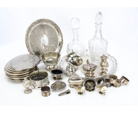 A collection of silver and silver plate, including a pair of metal mounted shell salts, a silver scent bottle, silver napkin 