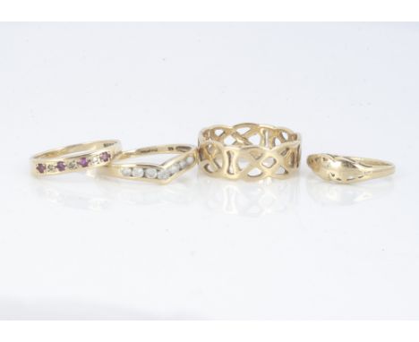 Four 9ct gold rings, including a Celtic knot band, a ruby and diamond seven stone ring and two others, 6.7g (4) 