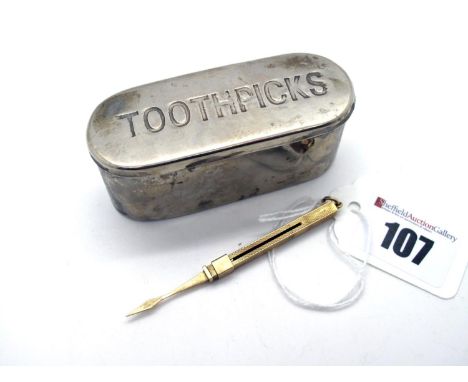 A 9ct Gold Engine Turned Tooth Pick, of sliding action, with suspension loop, extended length 7.5cm (3.5grams); together with