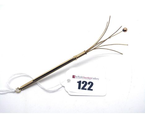 A Cocktail Swizzle Stick, allover engine turned, stamped "9ct", (4grams).