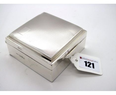 A Hallmarked Silver Cigarette Box, Walker &amp; Hall, Chester 1939, of plain design, with engine turned lid, 8.5cm wide. 