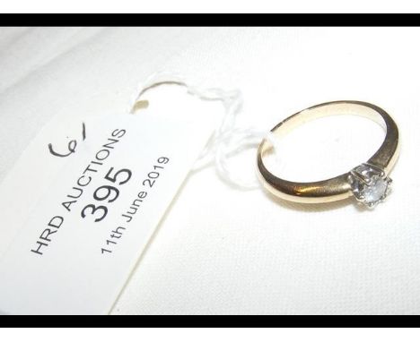 A diamond Solitaire ring in 9ct gold setting 