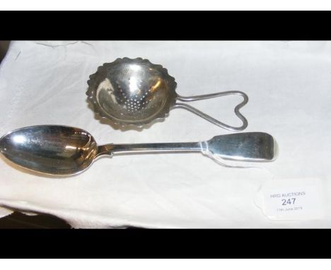A silver serving spoon, together with silver strainer 