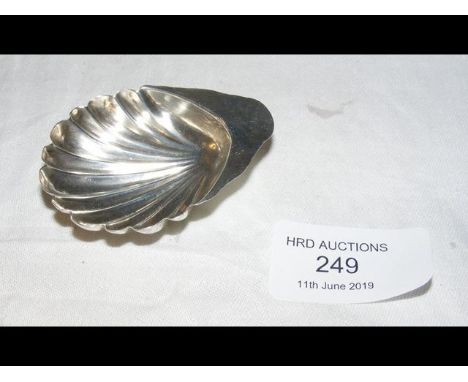 A shell shaped silver caddy spoon with 1891 hallmark 