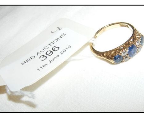 A sapphire and diamond ring in 18ct gold setting 