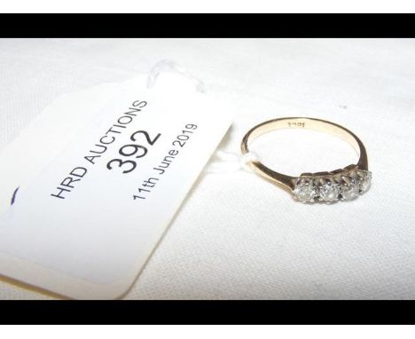 A four stone diamond ring in 18ct gold setting CONDITION REPORT2g