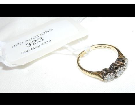 A three stone diamond ring in 18ct gold setting CONDITION REPORT3g